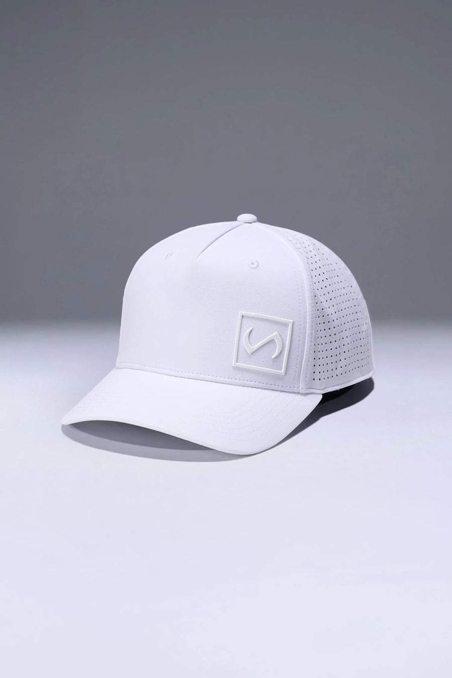 White Aero Core Performance Gym Hat with laser ventilation, water-repellent fabric and structured snapback fit by TLF Apparel – side view 