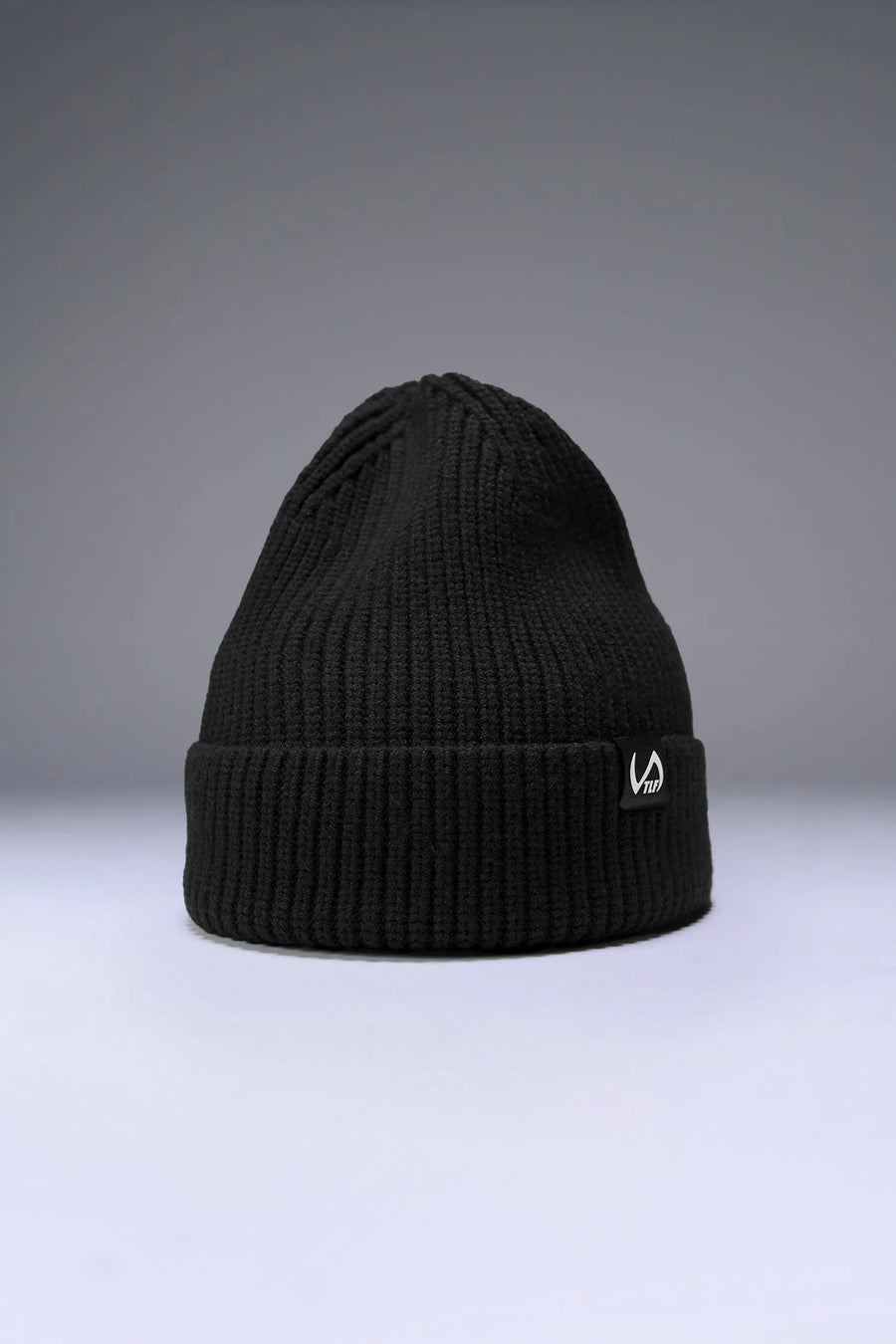 Black Unisex Cuffed Knit Beanie with a fold over cuff, TLF clip label and uses a premium viscose knit fabric blend for premium comfort by TLF Apparel – front view 