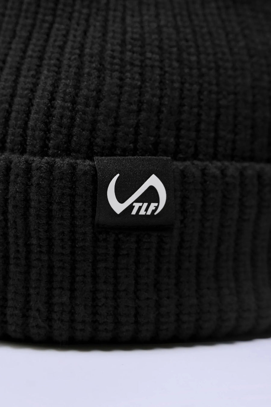 Black Unisex Cuffed Knit Beanie with a fold over cuff, TLF clip label and uses a premium viscose knit fabric blend for premium comfort by TLF Apparel 