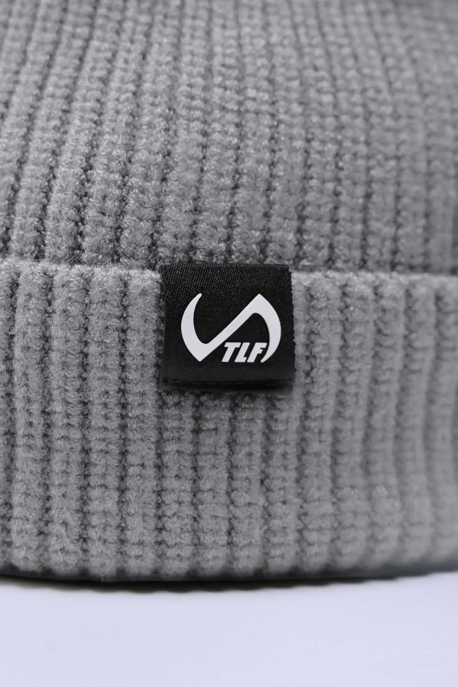 Detail Gray Unisex Cuffed Knit Beanie with a fold over cuff, TLF clip label and uses a premium viscose knit fabric blend for premium comfort by TLF Apparel – front view 
