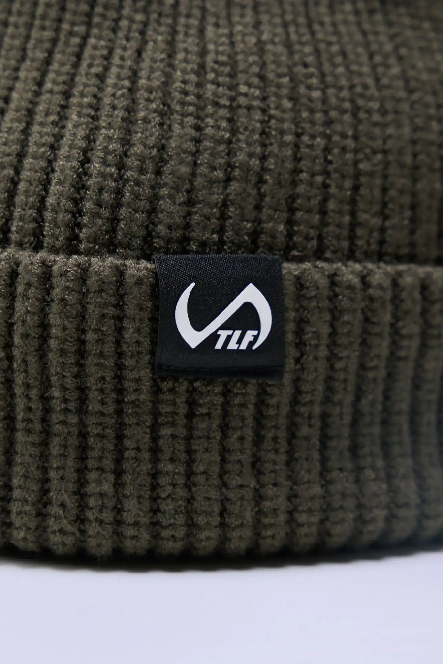 Sage Unisex Cuffed Knit Beanie with a fold over cuff, TLF clip label and uses a premium viscose knit fabric blend for premium comfort by TLF Apparel – detail view