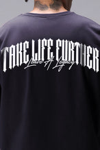 Black Sinister Cotton Luxe Oversized Tee with statement Take Life Further upper back graphic by TLF Apparel – detail view 