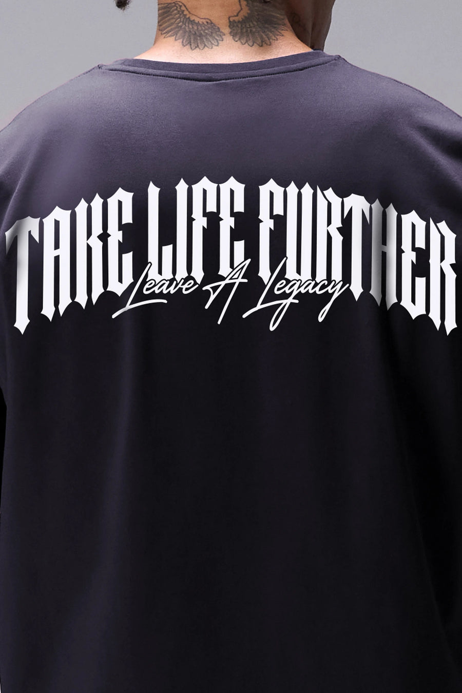 Black Sinister Cotton Luxe Oversized Tee with statement Take Life Further upper back graphic by TLF Apparel – detail view 