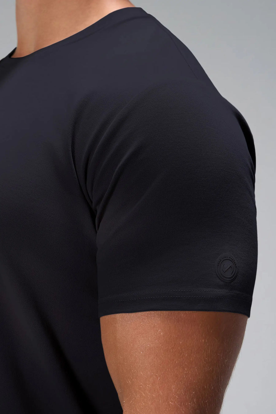 Black GTS Everyday Cotton Crew Neck Shirt showing tailored athletic fit through chest and arms by TLF Apparel – side view
