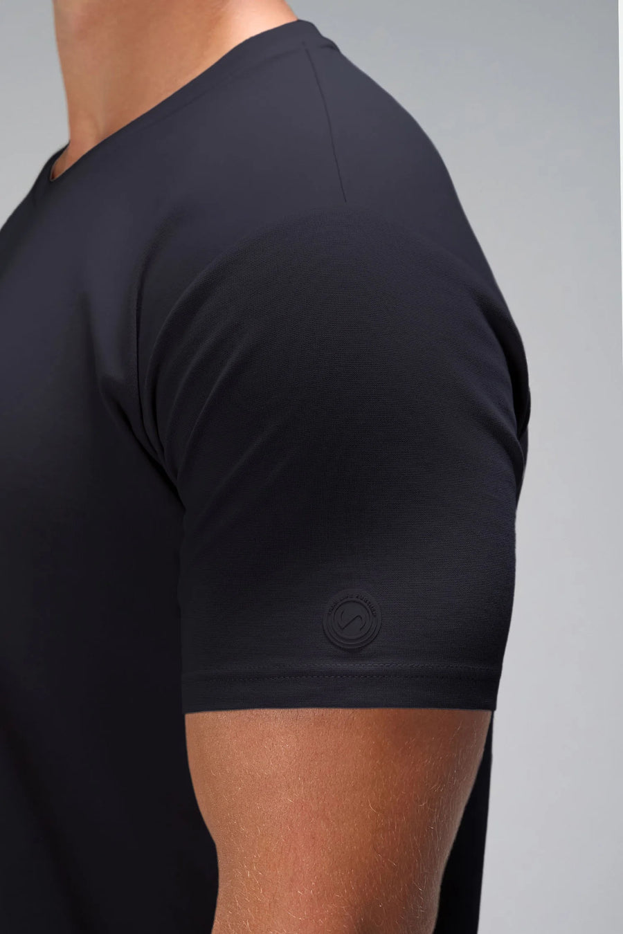 Black GTS Everyday Cotton V Neck Shirt showing sculpted silicone icon patch and cotton blend by TLF Apparel – detail view