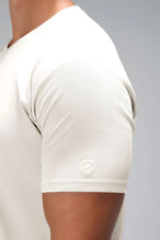 Beige GTS Everyday Cotton V Neck Shirt showing sculpted silicone icon patch and cotton blend by TLF Apparel – detail view