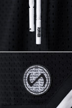 Black TLF Evolve Mesh 6 Inch Shorts showing Mesh Tech DNA™ fabric, striped ribbed waistband, and premium construction details by TLF Apparel – detail view
