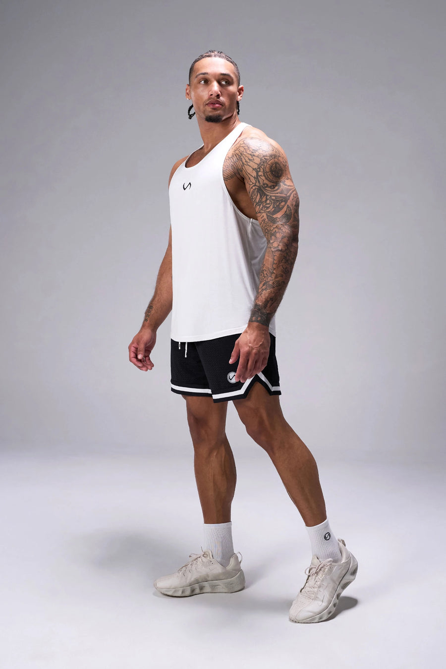 Black TLF Evolve Mesh 6 Inch Shorts showing 6 inch inseam fit, breathable mesh fabric, and athletic relaxed silhouette by TLF Apparel – side view