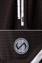 Brown TLF Evolve Mesh 6 Inch Shorts showing Mesh Tech DNA™ fabric, striped ribbed waistband, and premium construction details by TLF Apparel – detail view