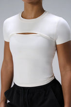 Cream NeoCloud™ Keyhole Short Sleeve Top showing keyhole cutout across chest by TLF Apparel – detail view