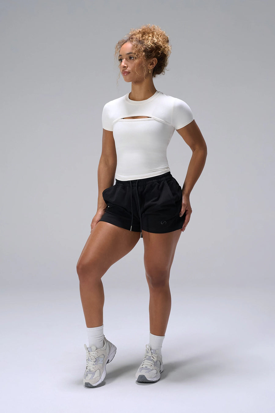 Cream NeoCloud™ Keyhole Short Sleeve Top showing fitted t shirt silhouette by TLF Apparel – front view