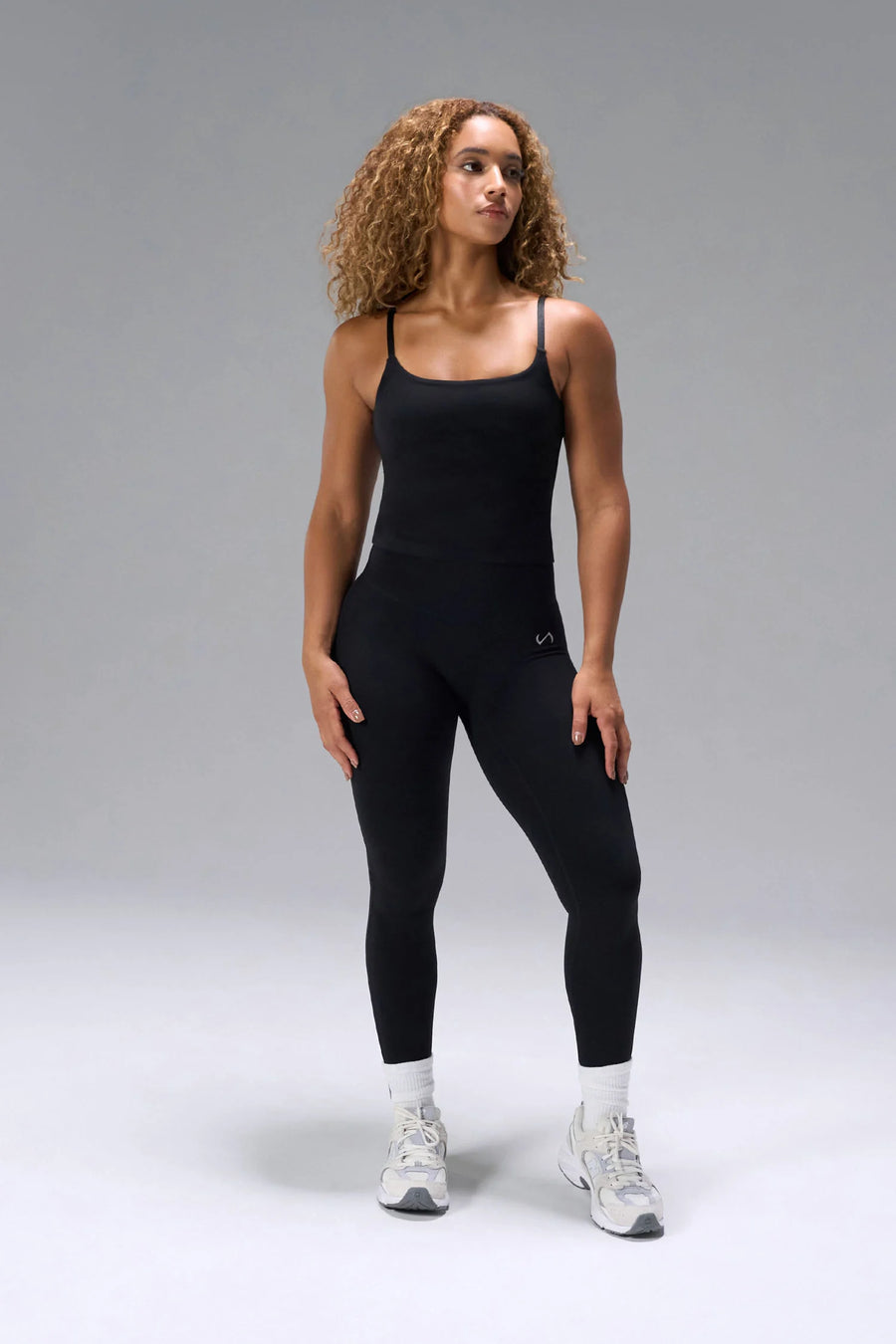 Black NeoCloud™ Built In Bra Tank with shelf bra and adjustable straps for everyday wear by TLF Apparel – front view