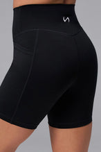 Black Tempo 6 Inch Gym Shorts With Pockets showing Luxe DNA™ fabric and Hi-Tech Gel TLF logo by TLF Apparel – detail view