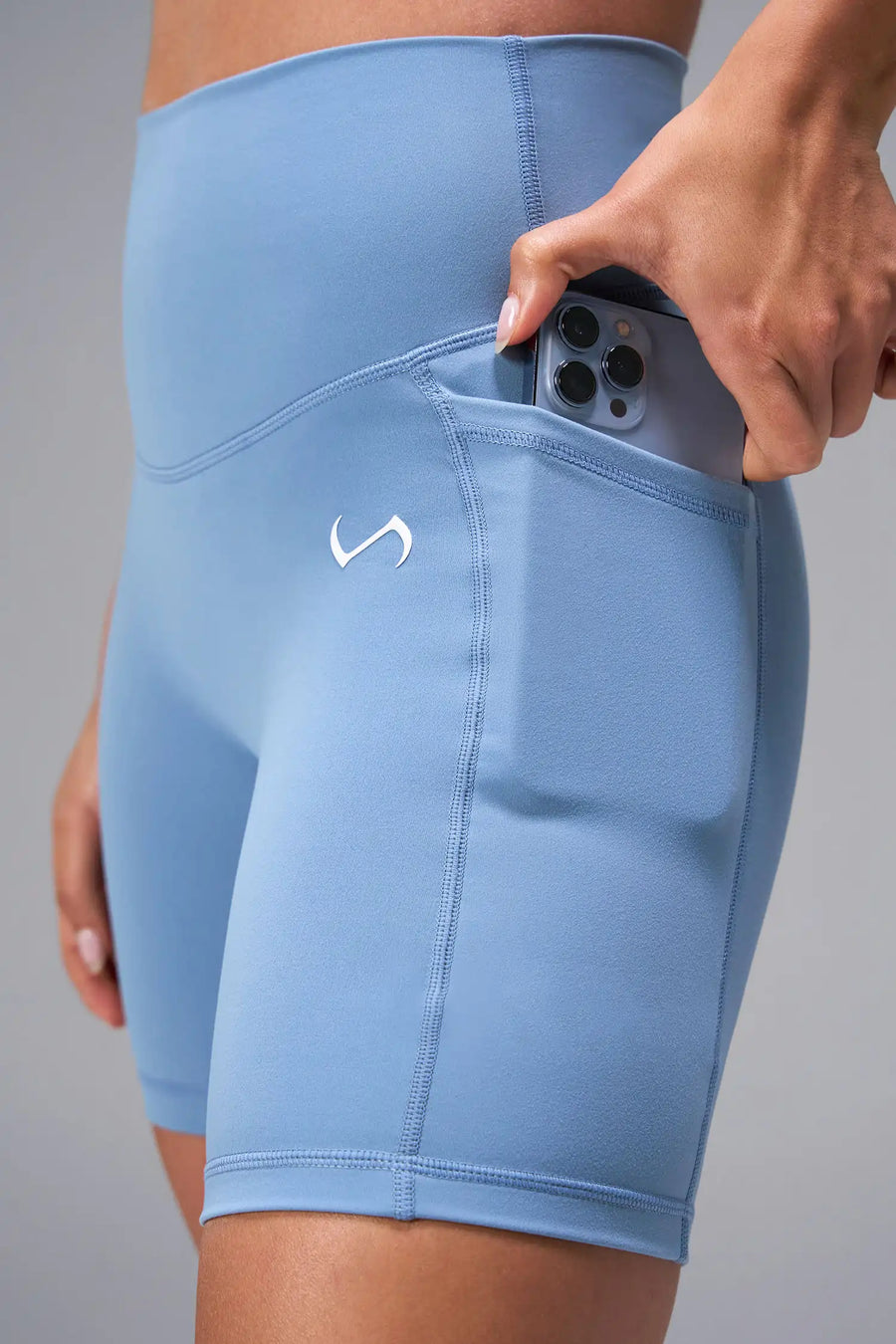 Blue Tempo 6 Inch Gym Shorts With Pockets showing sculpted fit and dual side phone pockets by TLF Apparel – side view