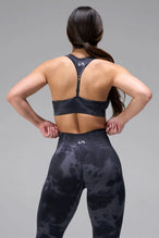 Back View of Meteorite TLF Cosmic Seamless Scrunch Butt Leggings, featuring a scrunch butt to shape and contour your glutes 