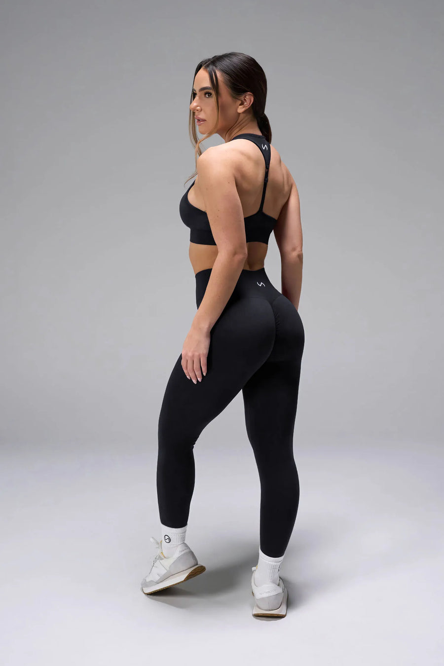 Side View of Black Tie Dye TLF Cosmic Seamless Sports Bra features adjustable strap for custom fit with high support for performance and functionality
