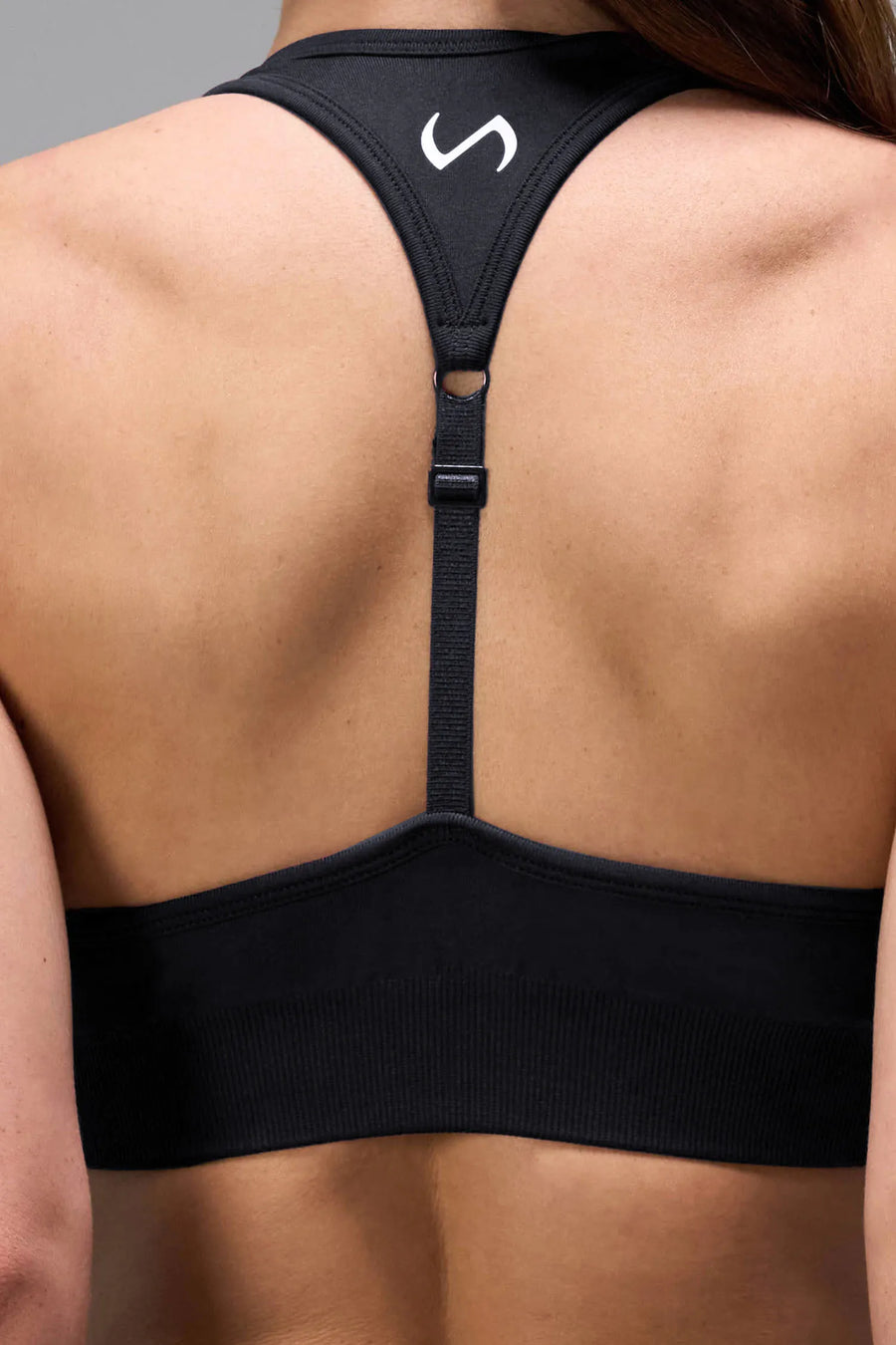 Side View of Black Tie Dye TLF Cosmic Seamless Sports Bra features adjustable strap for custom fit with high support for performance and functionality 
