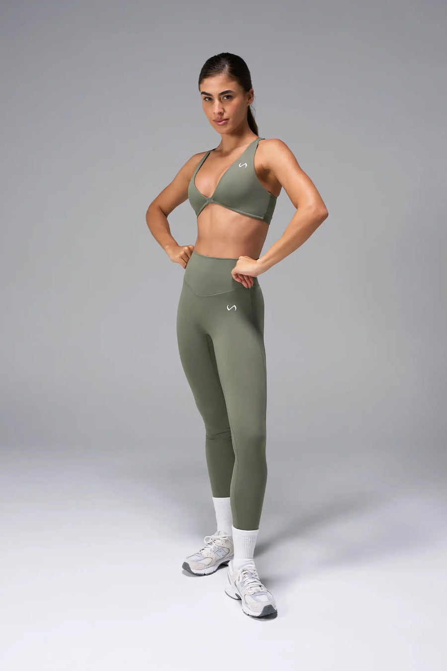 Green Tempo Front Clasp Sports Bra with Luxe DNA™ fabric and medium support for workouts and training by TLF Apparel – front view