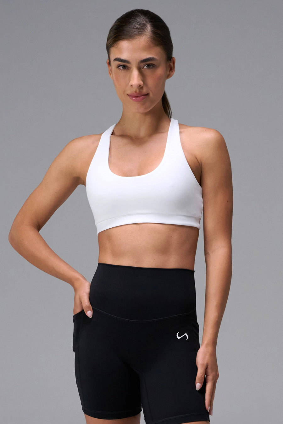 White Tempo Racerback Sports Bra in Luxe DNA™ fabric, a reversible low impact sports bra by TLF Apparel – front view