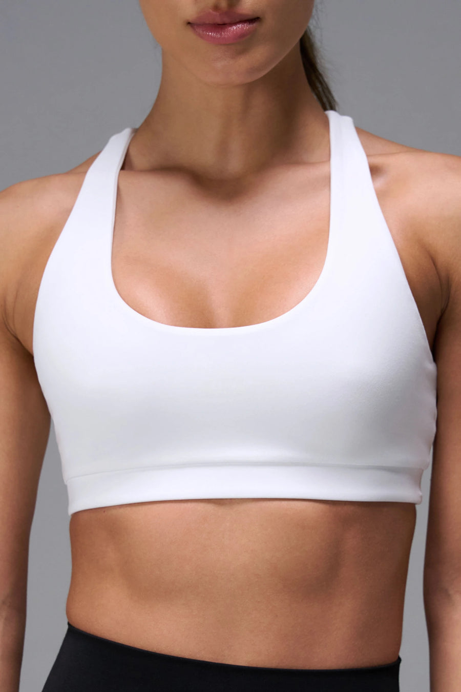 White Tempo Racerback Sports Bra, a reversible racerback bra for Gym-To-Street® wear by TLF Apparel – front view