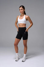 White Tempo Racerback Sports Bra reversed to its contrasting inside color, a two tone sports bra by TLF Apparel – front view