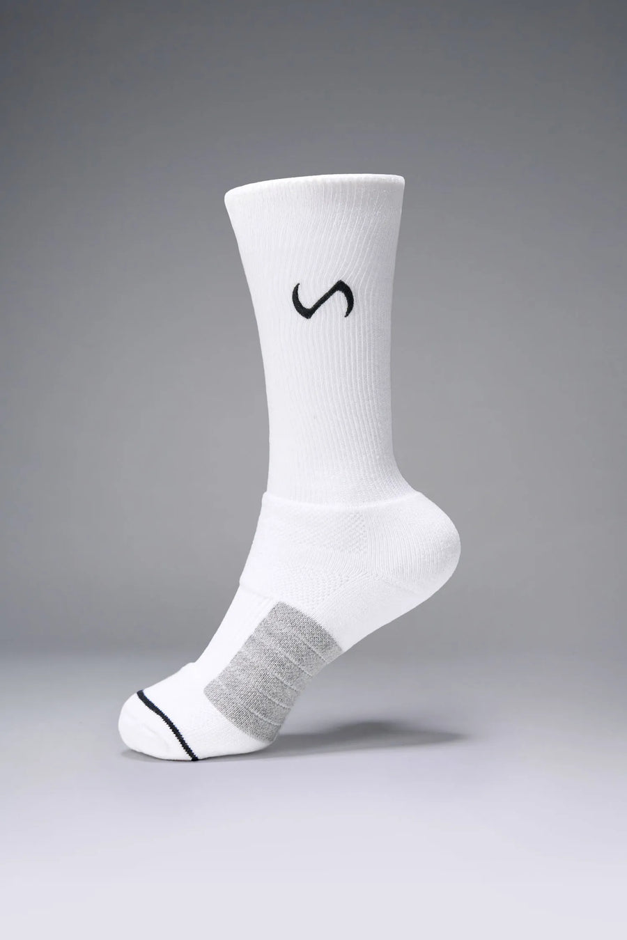 White Unisex Performance Crew Socks with medium cushioning, targeted compression, and jacquard foot mapping for support and comfort by TLF Apparel – side view 