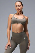 Front View of Brown TLF Cosmic Seamless Strappy Sports, featuring medium impact support and a strappy back design 