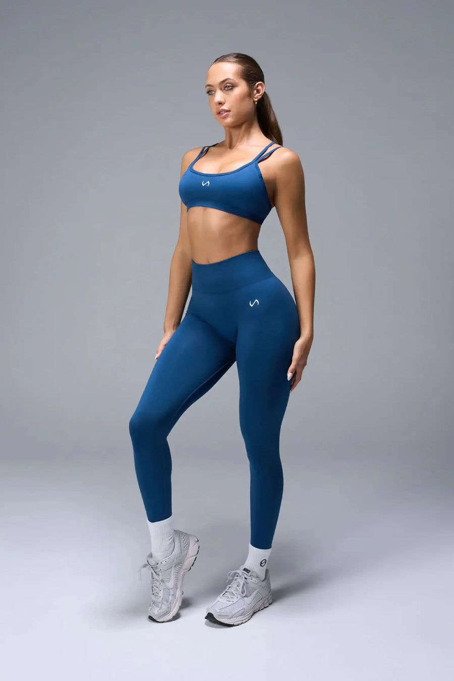 Front View of Blue TLF Cosmic Seamless Strappy Sports, featuring medium impact support and a strappy back design 