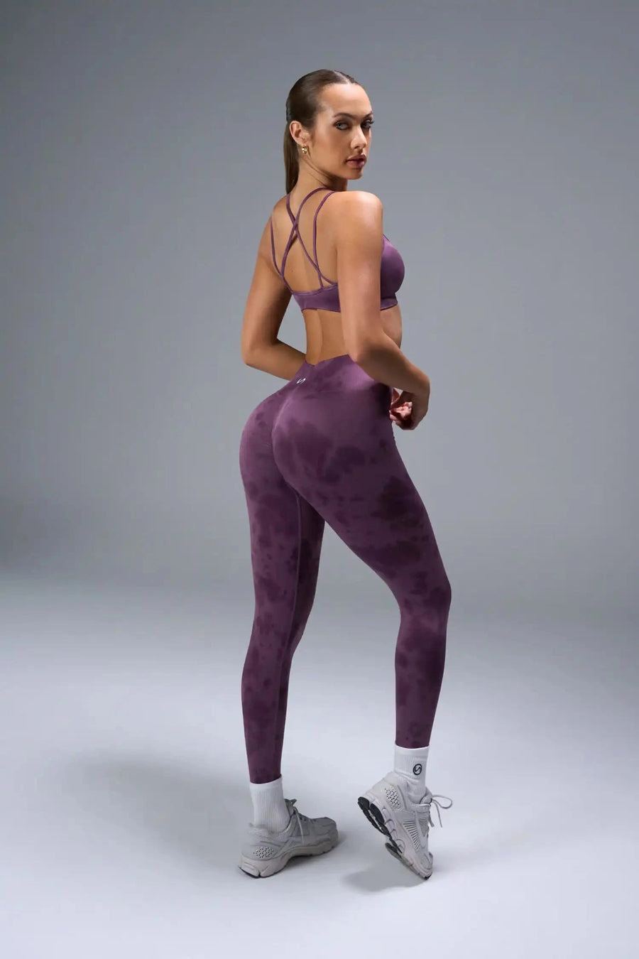 Back View of Purple TLF Cosmic Seamless Strappy Sports, featuring medium impact support and a strappy back design 