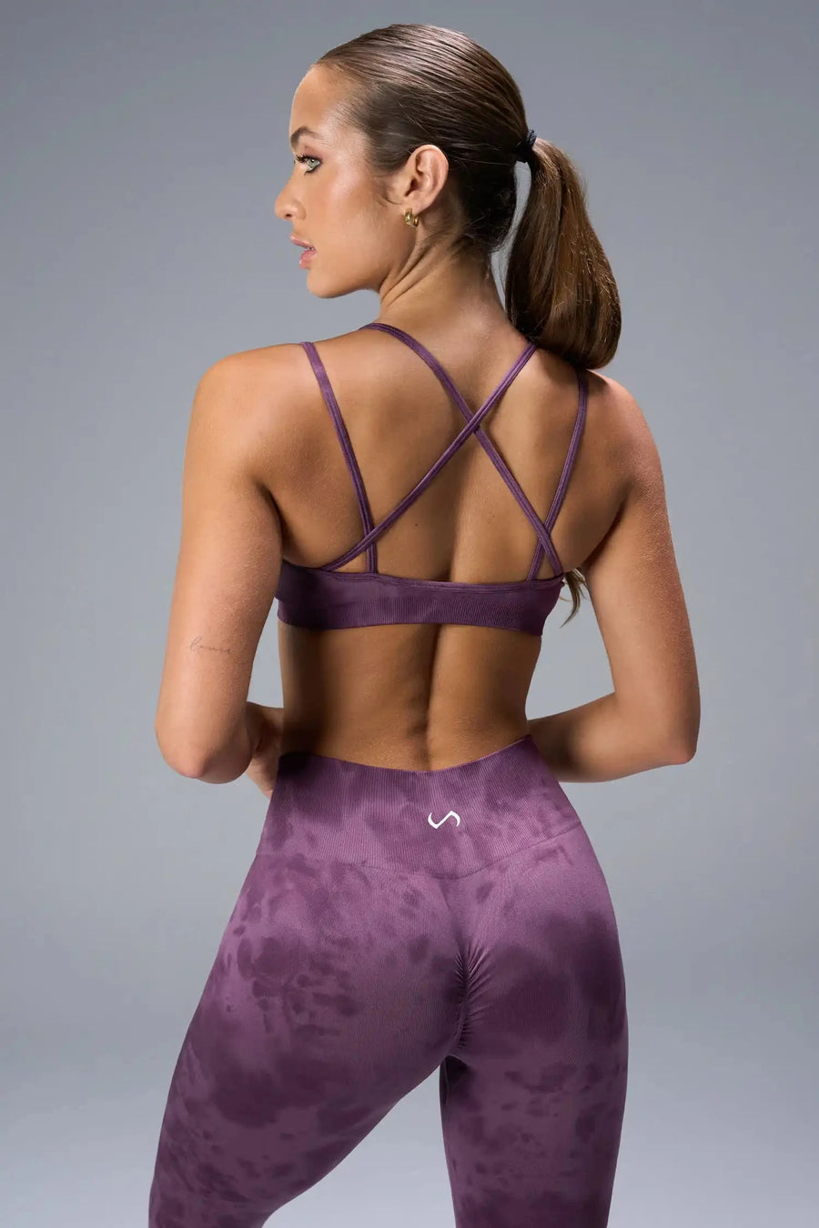 Detail Front View of Purple TLF Cosmic Seamless Strappy Sports, featuring medium impact support and a strappy back design 