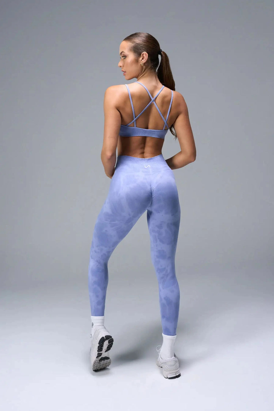 Back View of Blue TLF Cosmic Seamless Scrunch Butt Leggings, featuring a scrunch butt to shape and contour your glutes 