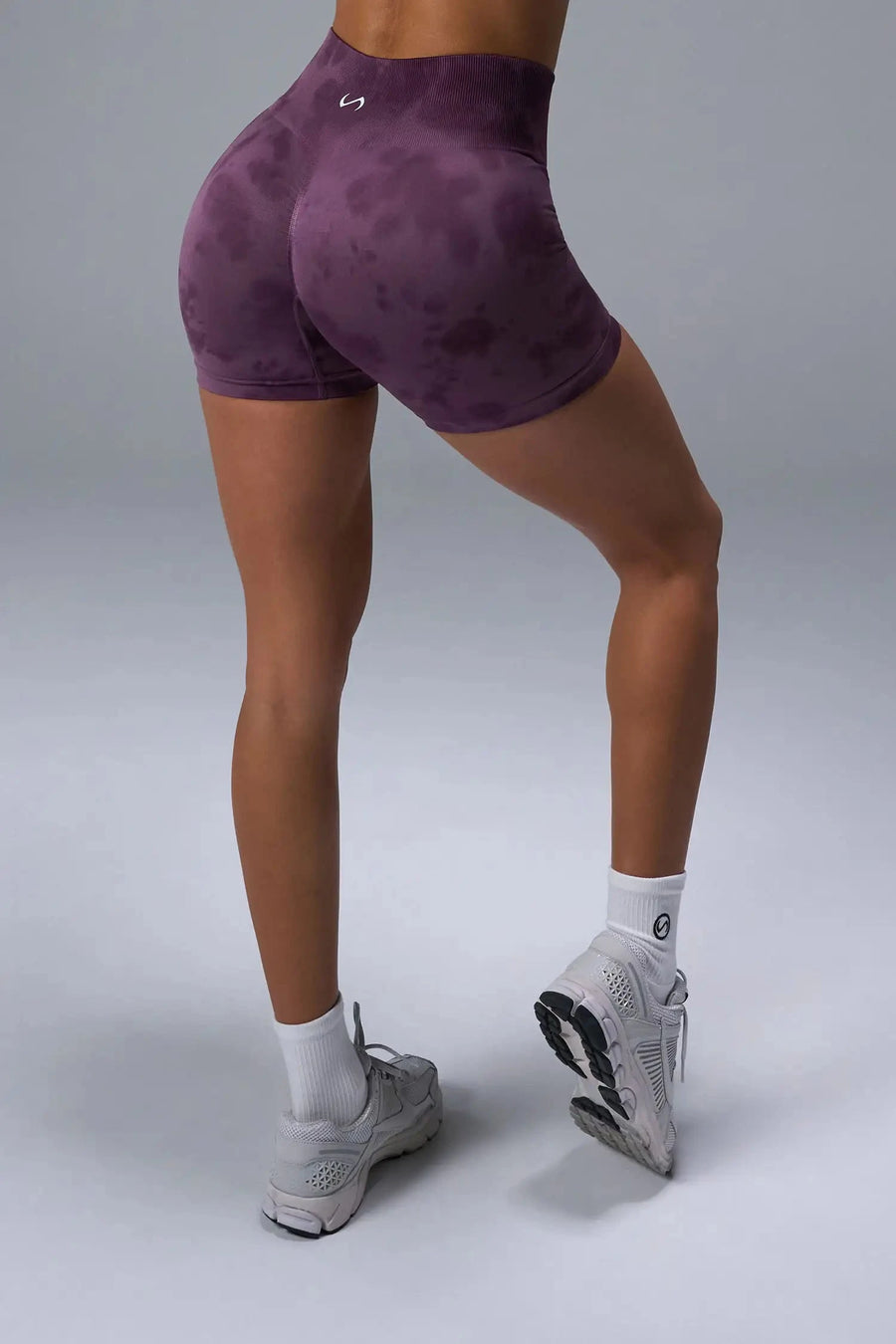 Back View of Purple TLF Cosmic Seamless Scrunch Butt Shorts, featuring a scrunch butt to shape and contour your glutes 