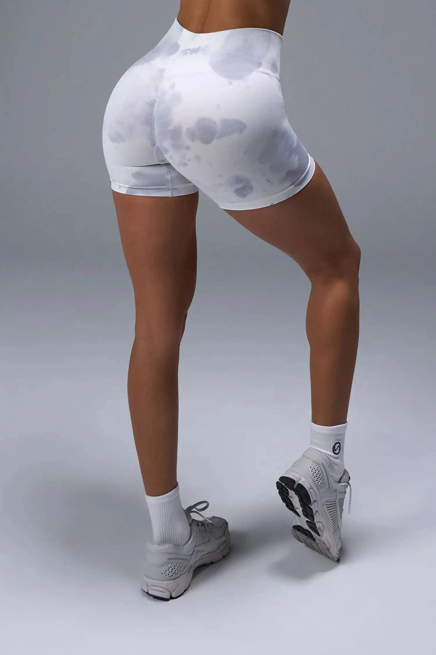 Back View of White TLF Cosmic Seamless Scrunch Butt Shorts, featuring a scrunch butt to shape and contour your glutes 
