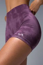 Side View of Purple TLF Cosmic Seamless Scrunch Butt Shorts, featuring a scrunch butt to shape and contour your glutes 