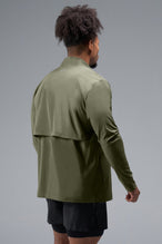 Back View of Green TLF Element Athletic Jacket, featuring multiple zipper pockets, and ripstop panels for breathability and stretch 