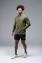 Front View of Green TLF Element Athletic Jacket, featuring multiple zipper pockets, and ripstop panels for breathability and stretch 