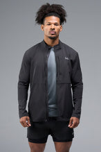 Front View of Black TLF Element Athletic Jacket, featuring multiple zipper pockets, and ripstop panels for breathability and stretch 
