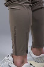 Detail Back View of Brown TLF Element Athletic Joggers 2.0, featuring side zipper pockets and side leg cargo pockets and reflective details 