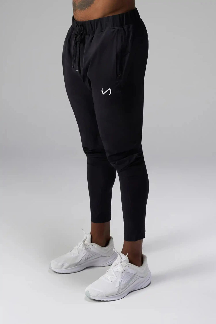 Front View of Black the TLF Element Infi-Dry Hybrid Joggers featuring side zipper pockets, zippered ankles and drawcord waistband for a custom fit. 