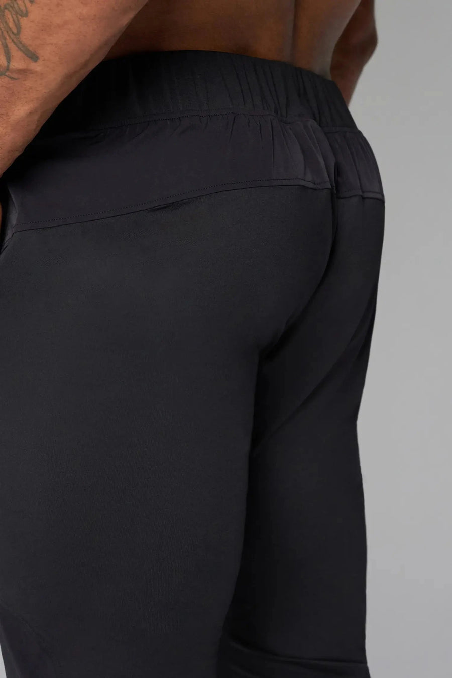 Back View of Black the TLF Element Infi-Dry Hybrid Joggers featuring side zipper pockets, zippered ankles and drawcord waistband for a custom fit. 