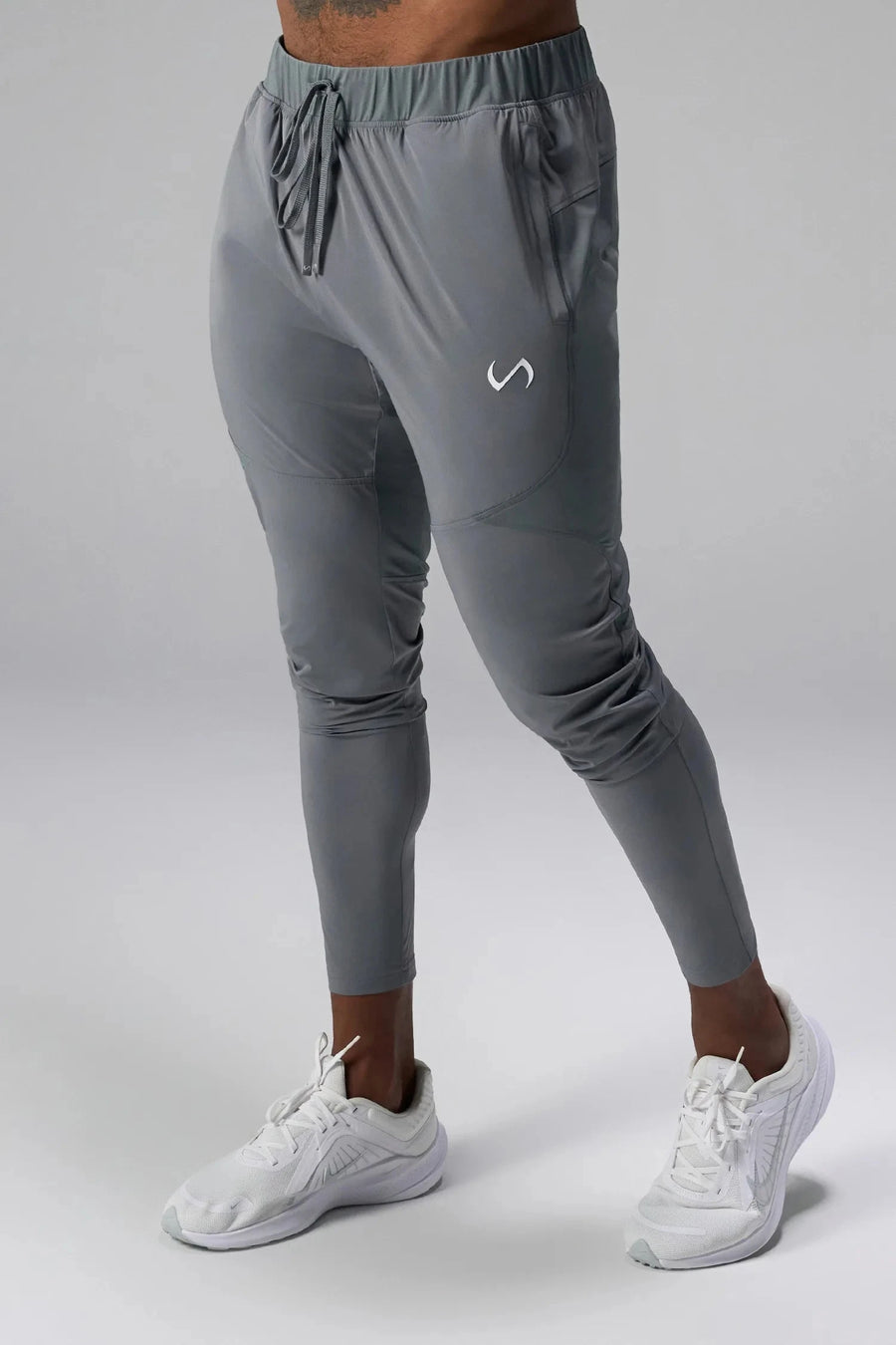 Front View of Gray the TLF Element Infi-Dry Hybrid Joggers featuring side zipper pockets, zippered ankles and drawcord waistband for a custom fit. 