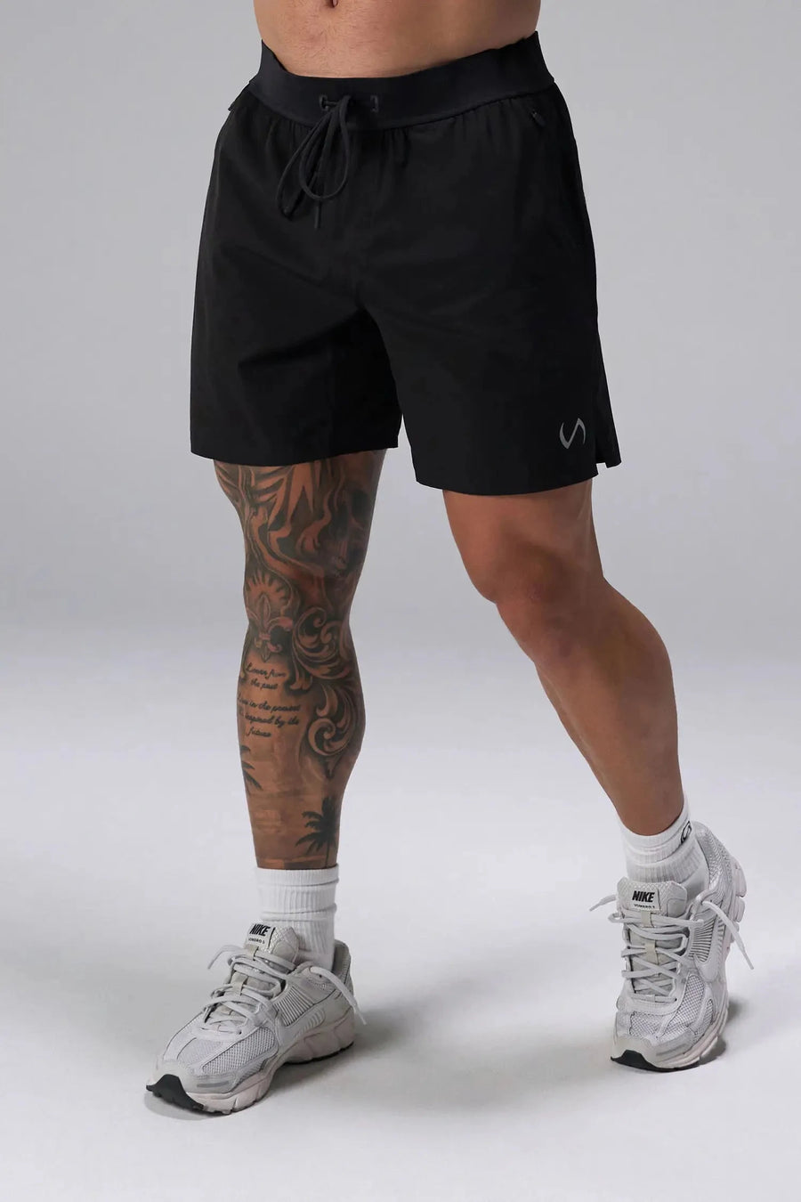 Front View of the Black the TLF Element Light 7 Inch Shorts featuring side zipper pockets, side split hems and reflective details for nighttime visibility