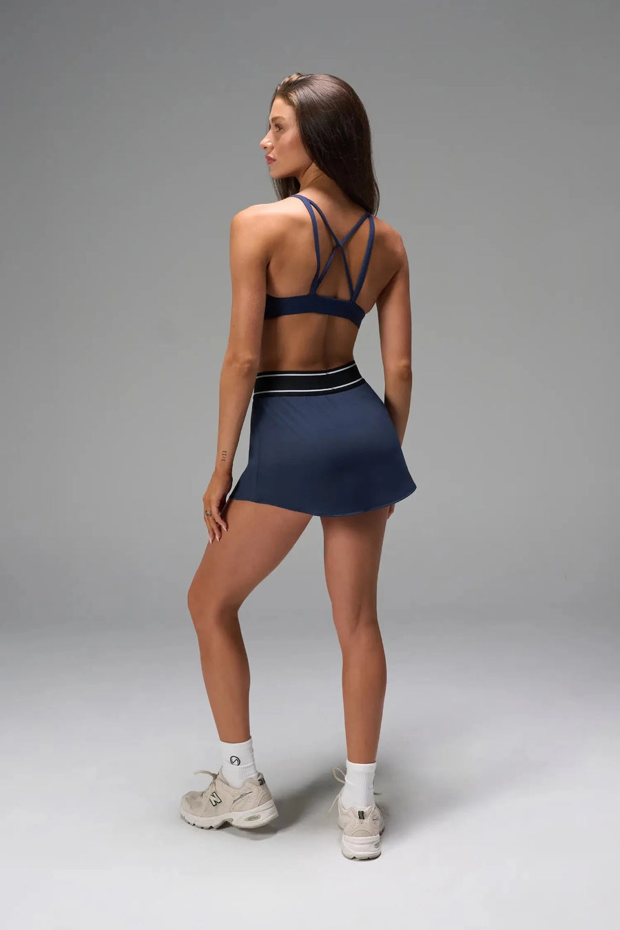 Back View of Blue TLF Element workout skirt featuring built in 2.5-inch inseam shorts and side pockets