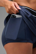 Detail Front View of Blue TLF Element workout skirt featuring built in 2.5-inch inseam shorts and side pockets