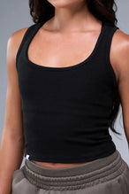 Front View of Black TLF Essential Ribbed Tank Top, featuring a scoop neckline in our ribbed tech fabric 