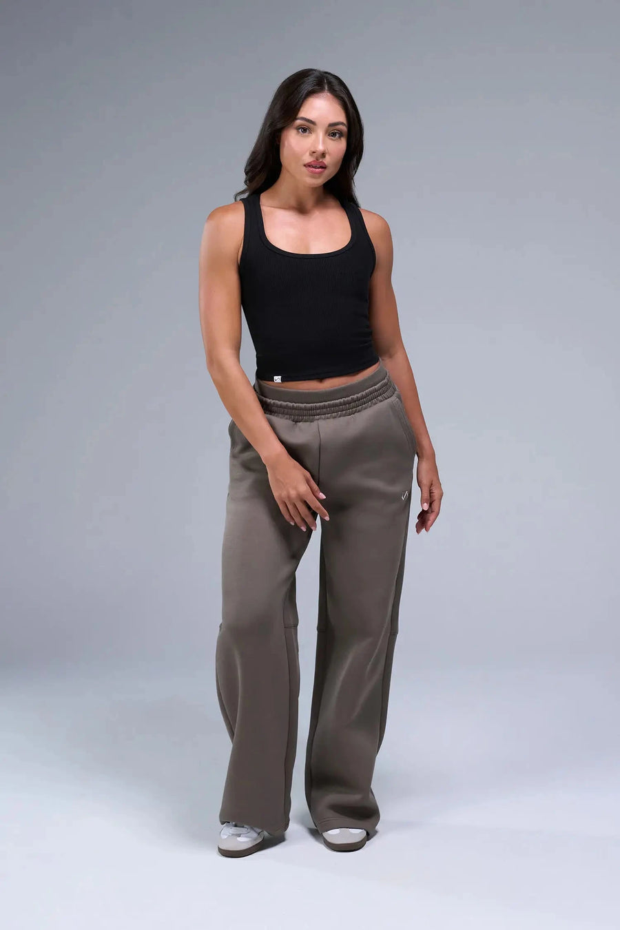Front View of Black TLF Essential Ribbed Tank Top, featuring a scoop neckline in our ribbed tech fabric 