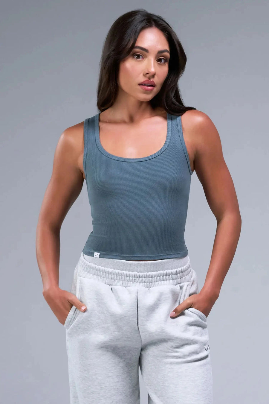 Front View of Blue TLF Essential Ribbed Tank Top, featuring a scoop neckline in our ribbed tech fabric 
