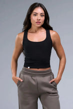 Front View of Black TLF Essential Ribbed Tank Top, featuring a scoop neckline in our ribbed tech fabric 