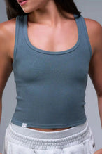 Front View of Blue TLF Essential Ribbed Tank Top, featuring a scoop neckline in our ribbed tech fabric 