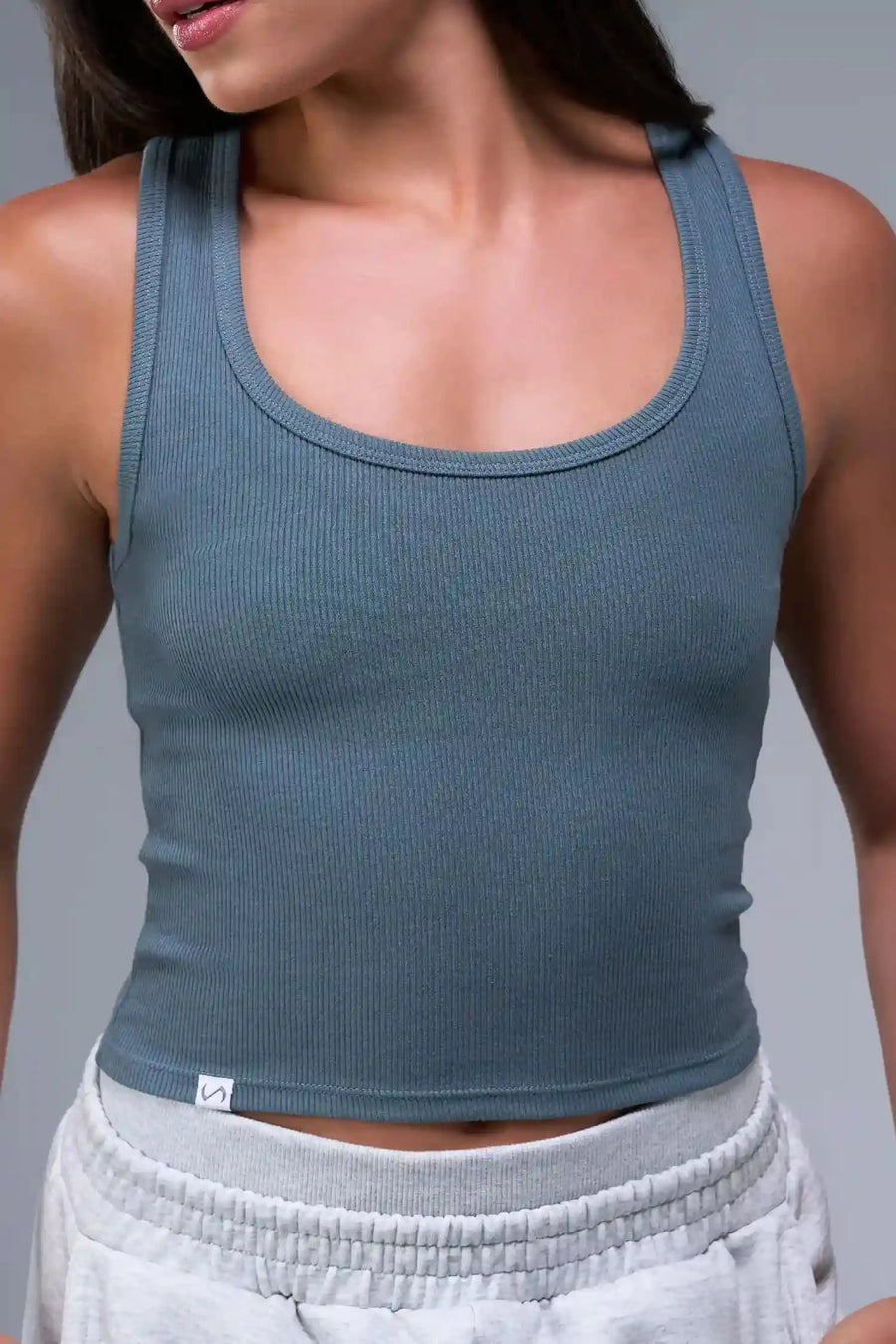 Front View of Blue TLF Essential Ribbed Tank Top, featuring a scoop neckline in our ribbed tech fabric 